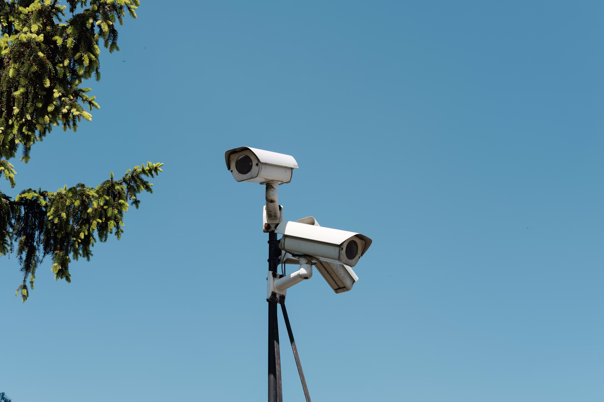 Industrial-grade outdoor security cameras mounted for perimeter surveillance in extreme Northern weather conditions.